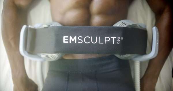 black man with abs on emsculpt neo