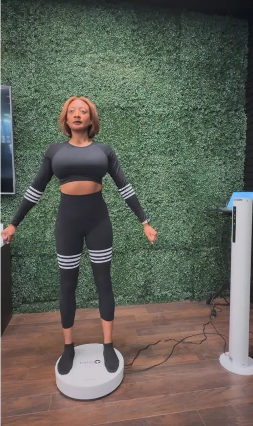 "Patient standing on Styku 3D body scanner platform at Fleur-De-Lis Aesthetics in New Orleans"